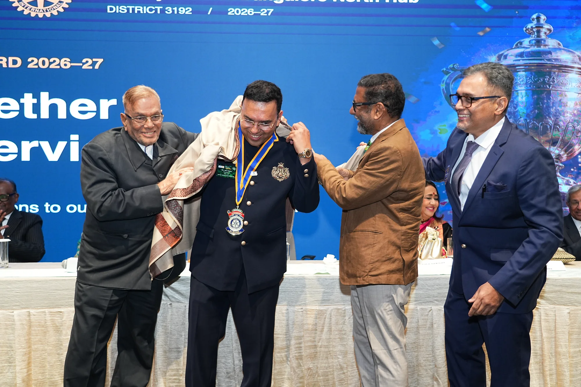 Our president wearing the Rotary collar and being honoured with a shawl at the charter installation