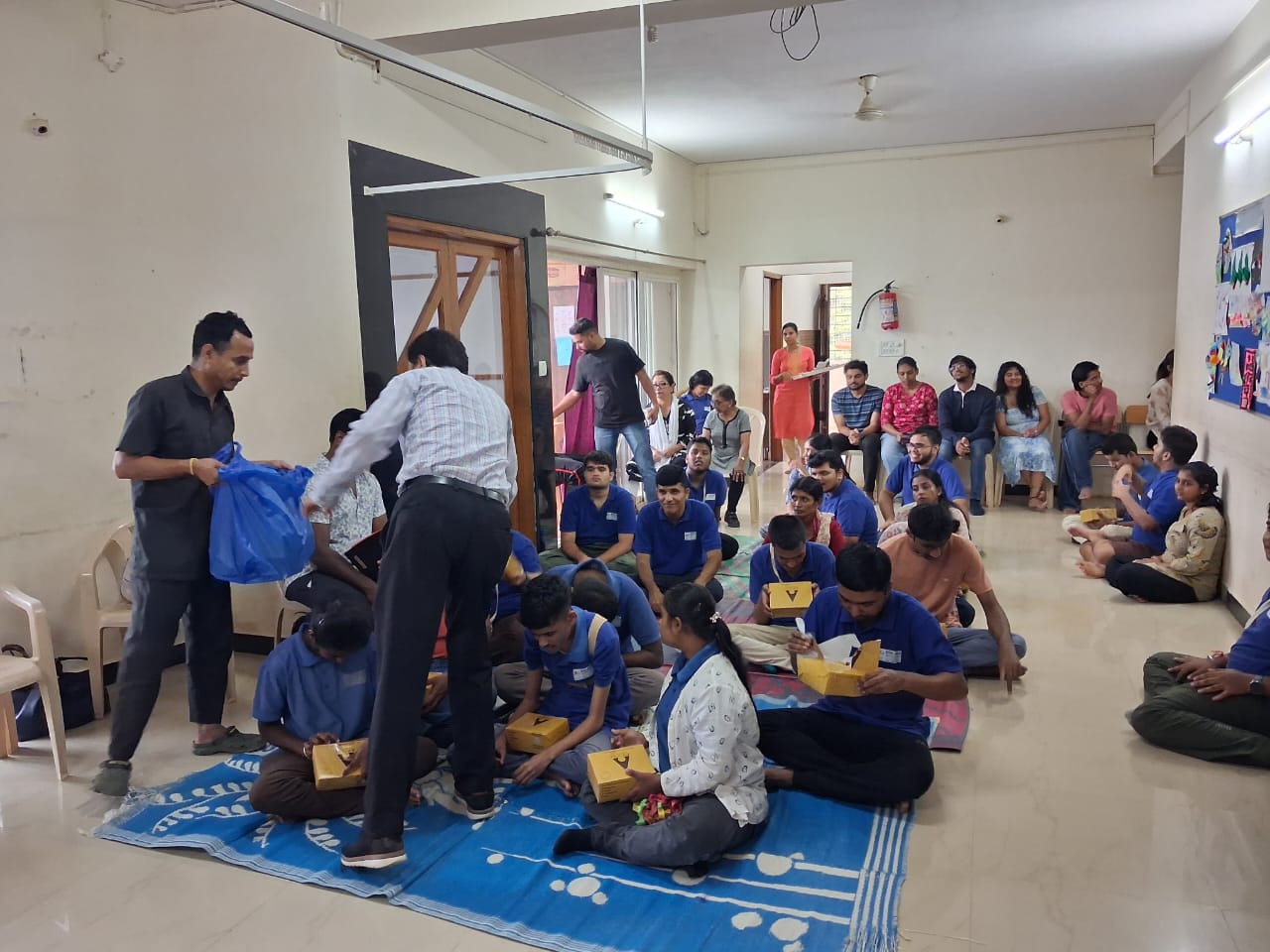 Food boxes being distributed during the PRAGATI community service visit