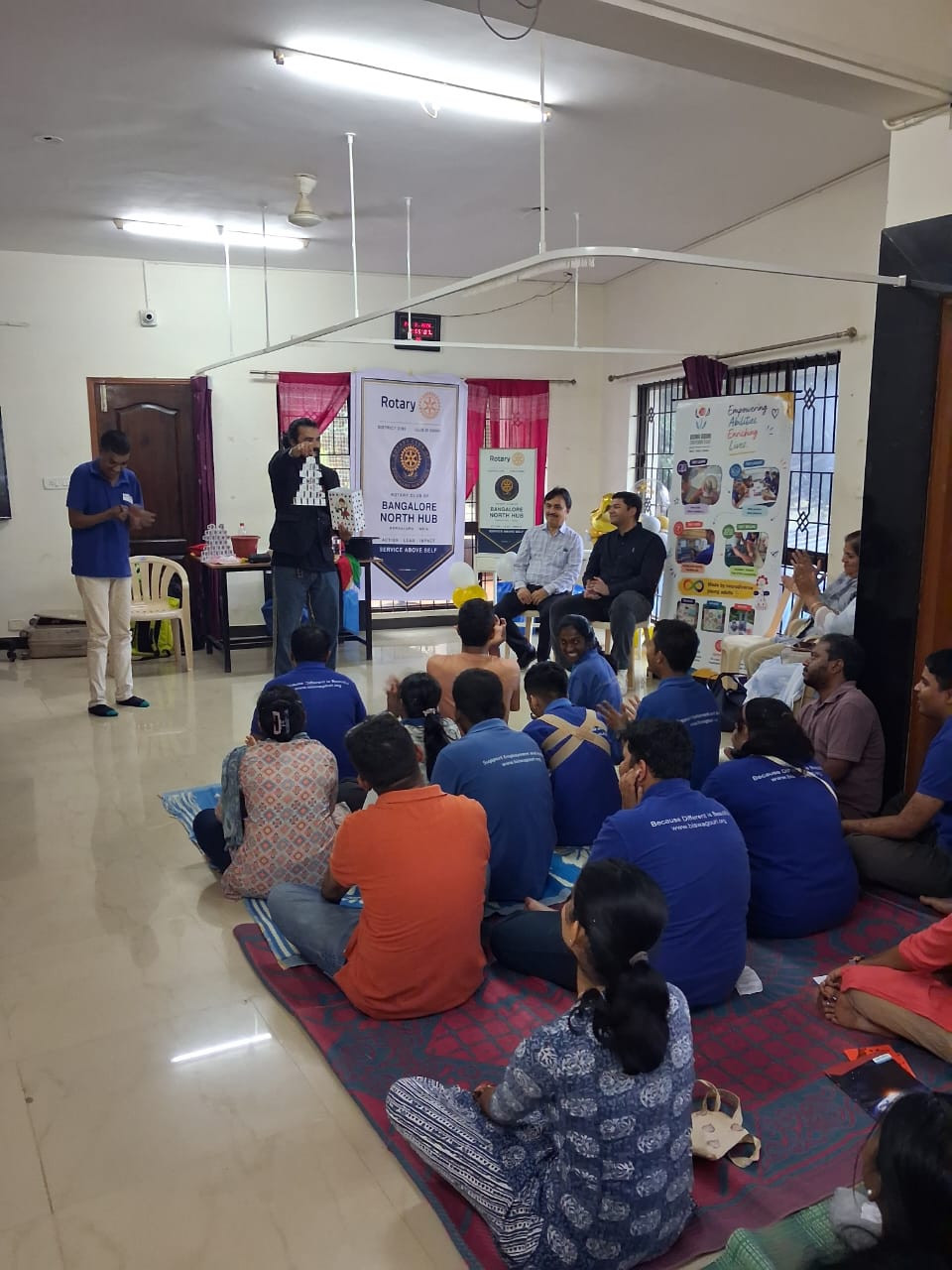 The magic show in progress with participants watching